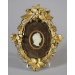 A EUROPEAN CARVED IVORY HEAD PORTRAIT PLAQUE, early 19th century, the male turned to sinister and