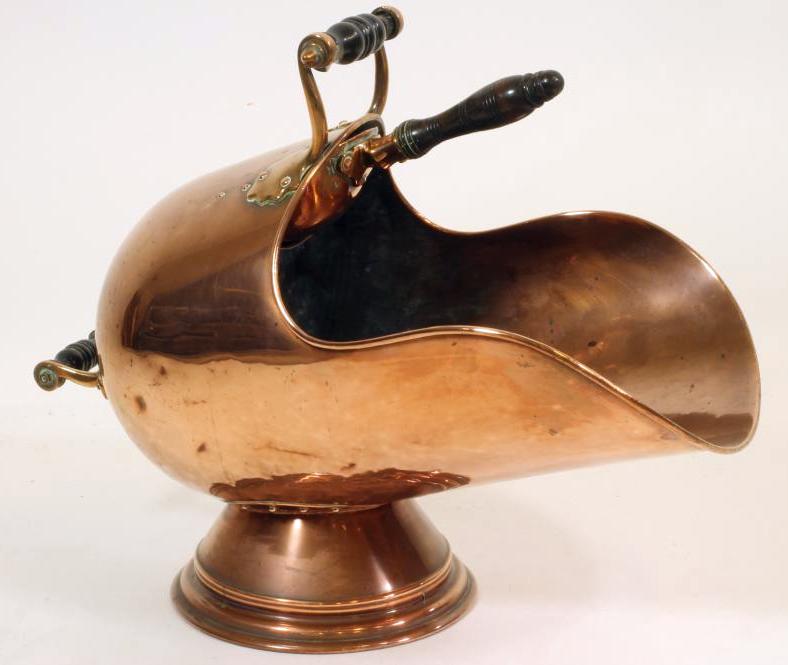 A VICTORIAN COPPER COAL SCUTTLE of helmet form, the loop handles with turned ebonised grips, on