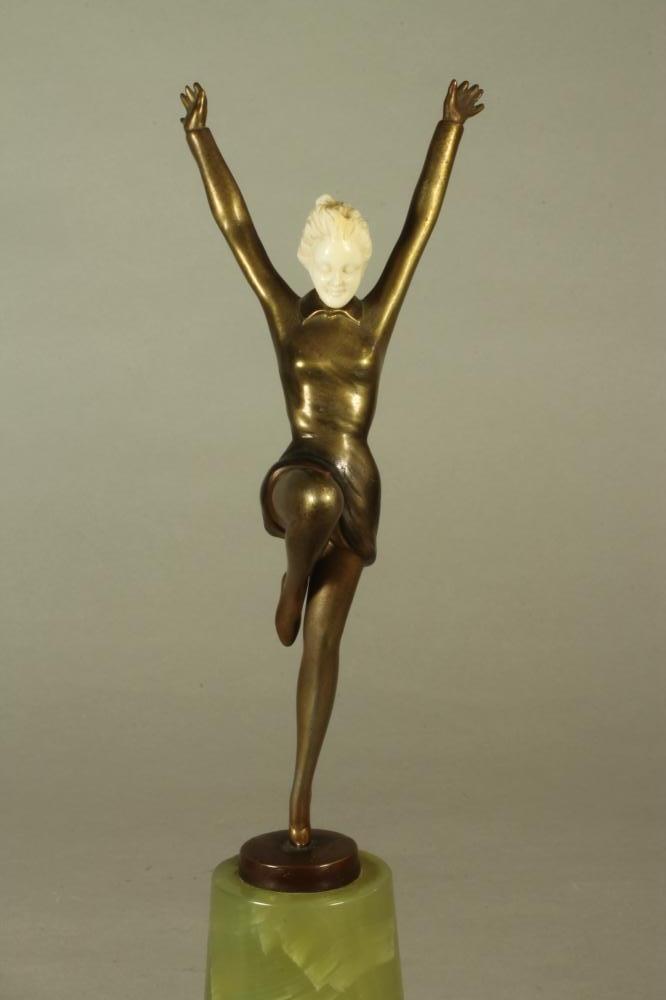 AN ART DECO BRONZE FIGURE OF A YOUNG FEMALE with carved ivory head, standing on her left leg with - Image 4 of 4