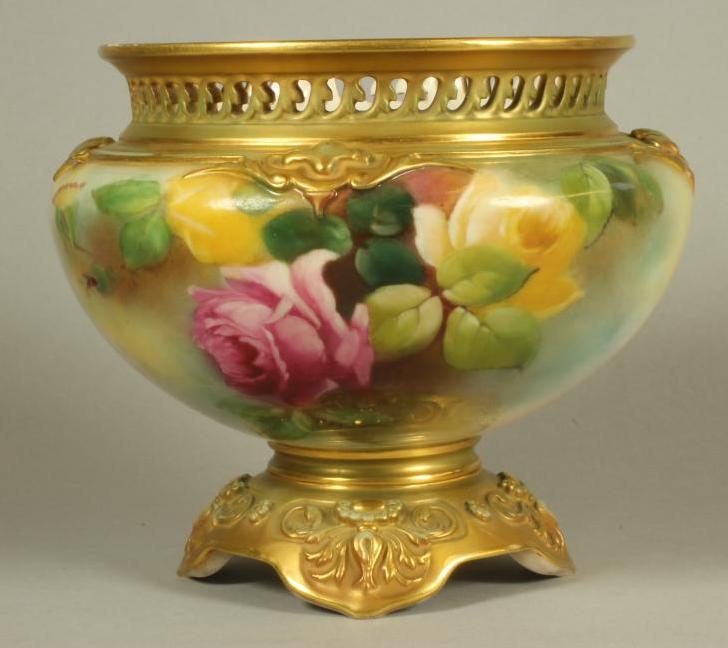 A ROYAL WORCESTER CHINA CACHE-POT, 1911, of squat globular form with wave pierced rim, painted in