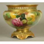 A ROYAL WORCESTER CHINA CACHE-POT, 1911, of squat globular form with wave pierced rim, painted in