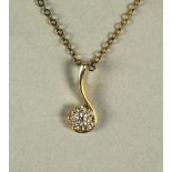 A DIAMOND PENDANT, the 9ct gold "S" scroll inset with a cluster of seven small brilliant cut claw