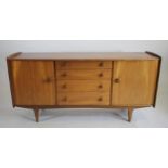 A TEAK LOW SIDEBOARD by A. Younger Ltd., of bowed form with raised mildly arched ends, four