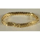 A 9CT GOLD BRACELET of triple brick link form, 7 1/2" long, 18g