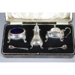 A THREE PIECE SILVER CRUET, makers G Bryan & Co., Birmingham 1941, in the Georgian style, with