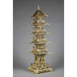 A JAPANESE IVORY PAGODA, early 20th century, of five tiers with a buddha shrine to the base, 18 1/2"