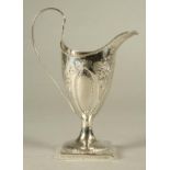 A LATE GEORGE III SILVER PEDESTAL HELMET MILK JUG, makers Wigan & Godbehere, London 1791, with