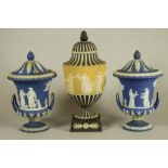 A WEDGWOOD THREE COLOUR JASPER DIP URN AND COVER, early 20th century, of ovoid form on waisted socle