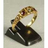 A VICTORIAN 18CT GOLD RING, gypsy set with an old brilliant cut diamond flanked by two facet cut