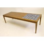 A DANISH DESIGN ROSEWOOD COFFEE TABLE, late 20th century, of rounded oblong form, the top with a