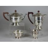 A FOUR PIECE SILVER TEA AND COFFEE SERVICE, makers Ogdens, Birmingham 1933, of semi fluted rounded