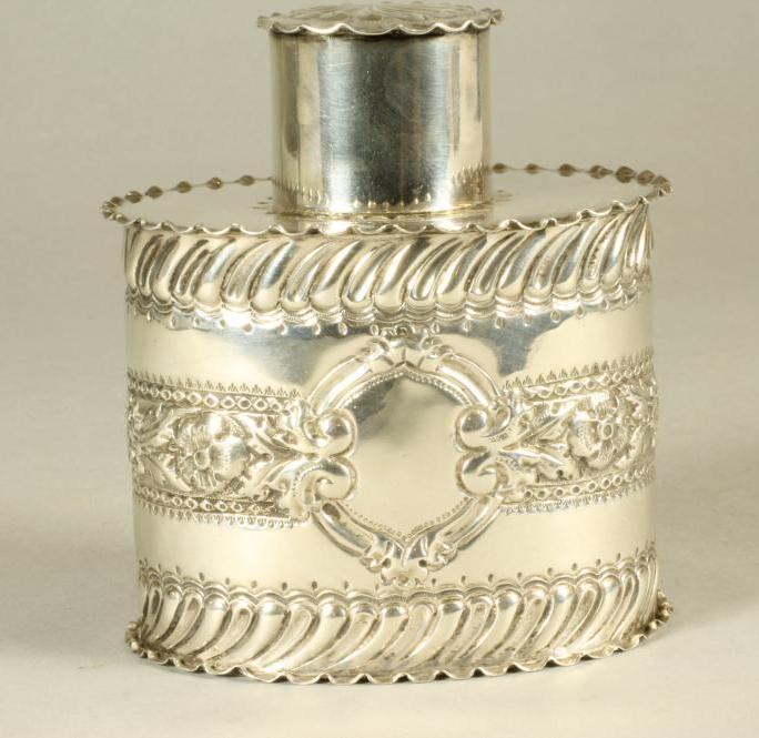 A LATE VICTORIAN SILVER TEA CANISTER, maker G M Jackson, London 1895, of oval form with lift-off