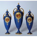 A ROYAL WORCESTER CHINA COMPOSITE THREE PIECE MANTEL GARNITURE, 1928/29,30, each two handled slender