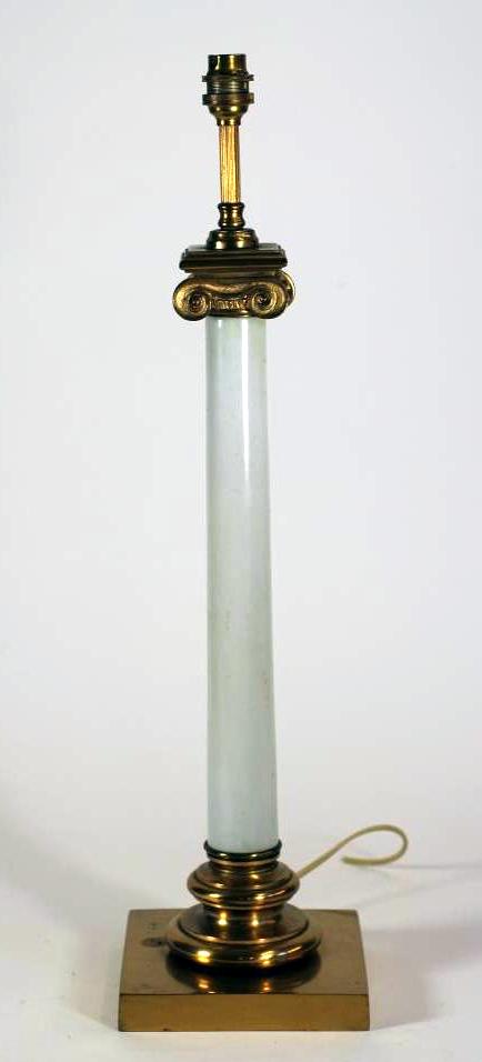 A REGENCY STYLE ELECTRIC TABLE LAMP BASE, the opalescent glass Ionic column with gilt brass capital,