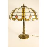 A GILT METAL ELECTRIC TABLE LAMP BASE, early 20th century, the tapering reeded column with stiff