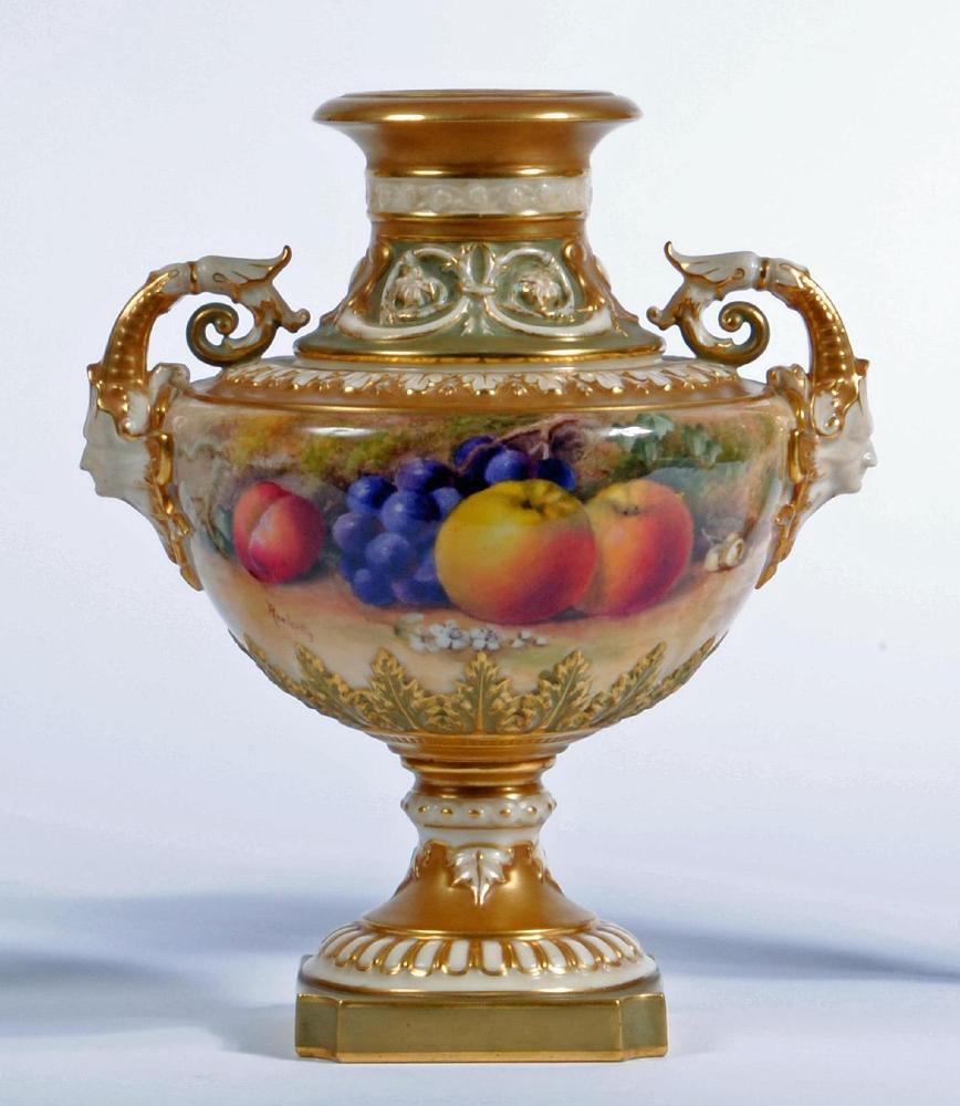 A ROYAL WORCESTER CHINA VASE, 1913, of squat baluster form with stiff leaf and scroll moulded