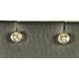 A PAIR OF DIAMOND STUD EARRINGS, each brilliant cut stone of approximately 0.18cts, collet set in