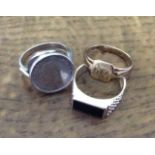 A 9ct gold ring and two silver rings