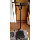 Vintage brass and iron stand on scales