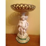 Good quality porcelain and parian tazza supported by cherubs c1850