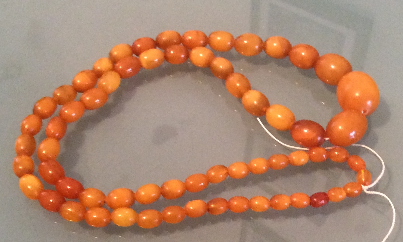 String of butterscotch amber beads 26 cms long