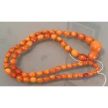 String of butterscotch amber beads 26 cms long