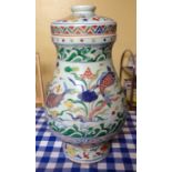 Polychrome decorated Chinese lidded vase