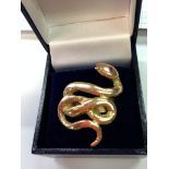 An 18ct gold snake ring with gemset eye size O