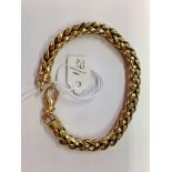 An 18ct gold bracelet 35gms