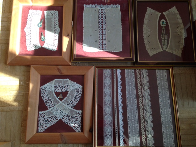 Five framed displays of lace, collars and crochet work