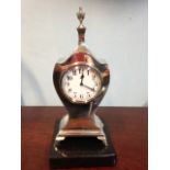 A small silver mantle clock B'ham 1921