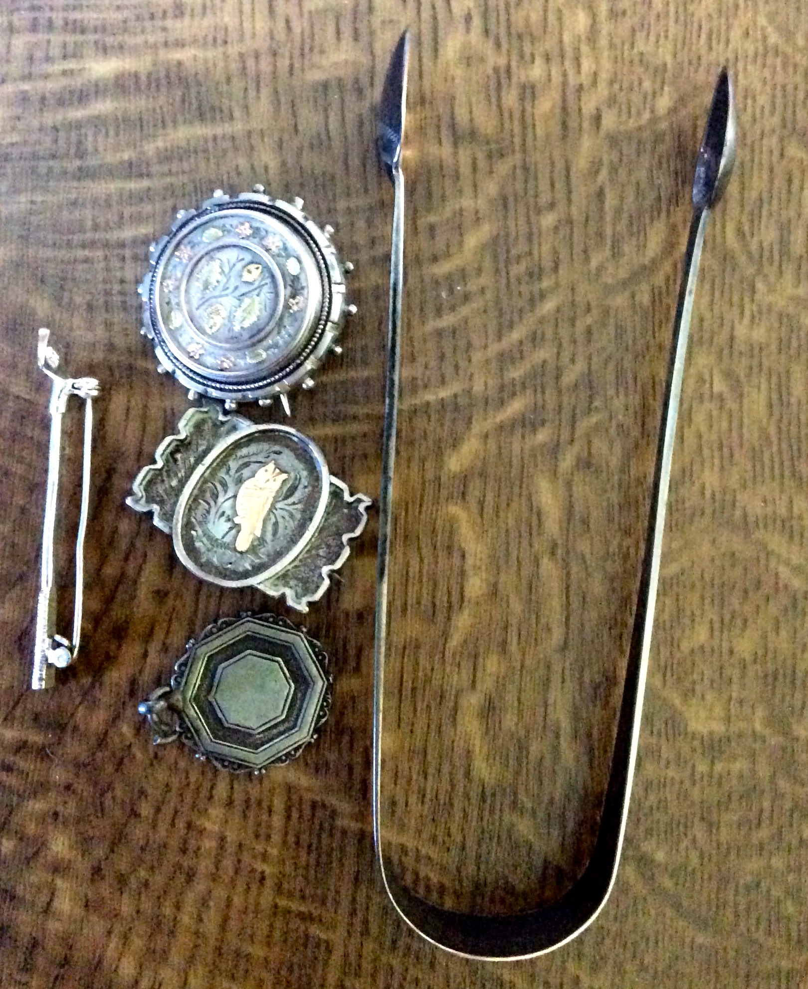 Five pieces silver inc. 18th c bright cut sugar tongs etc.