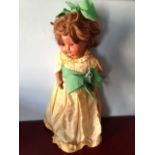 A 1950's crying doll with original clothes 48cms tall