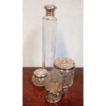 Three silver topped jars, shot glass etc