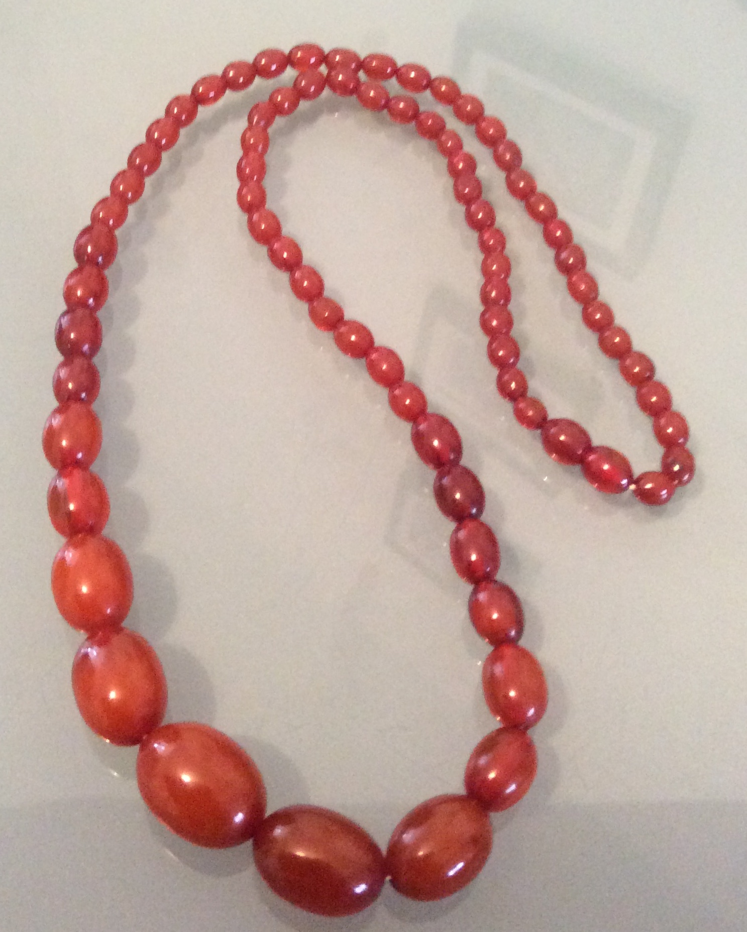 String of cherry amber beads 30cms long
