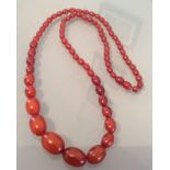 String of cherry amber beads 30cms long