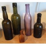 Five coloured named chemist bottles