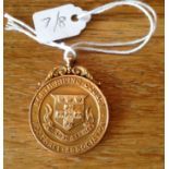 A 15ct gold medal from North Riding FA