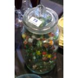 Large glass jar with collection of vintage marbles