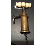 Brass and steel patent double ratchet corkscrew with bone handle in good condition lacking brush