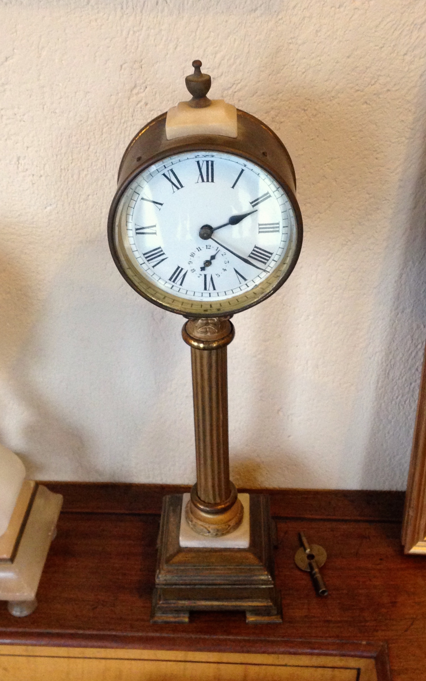 A 19th c pillar mantle clock with alarm