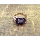 An 18ct gold and garnet mourning ring with hair decoration size O
