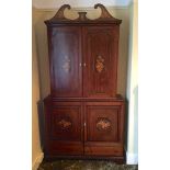 An 18th c cabinet on later base the whole with later floral