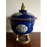 Powder blue porcelain bowl with enamel panels and gilt mounts