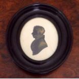 Good early 19th c oval hightened silhouette of a gentleman
