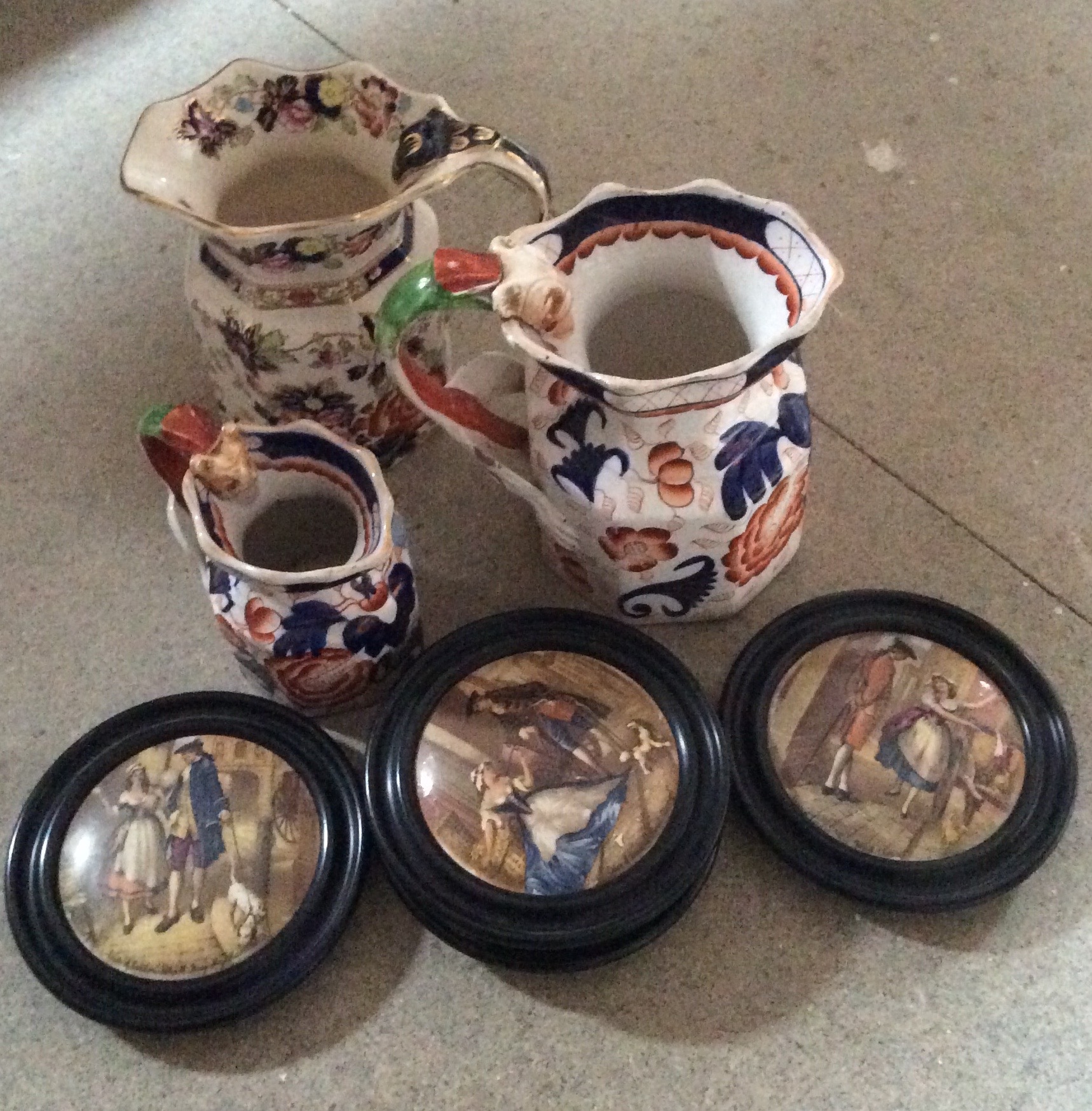 Three Masons jugs and four Cries of London pot lids