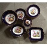 Good mid 19th c porcelain dessert service with well painted still life panels 18 items some a/f