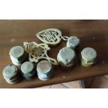 Selection of brass including hub caps, trivets etc.