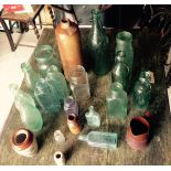 A collection of glass and stoneware bottles