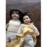 Armand Marseilles 390 bisque headed doll in good order together with another a/f